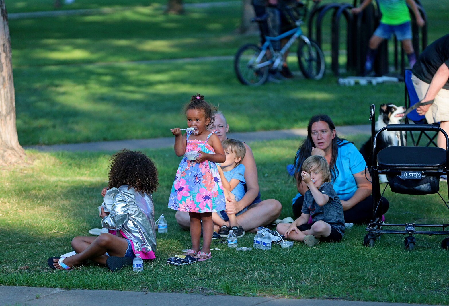 People enjoy a concert in the park
