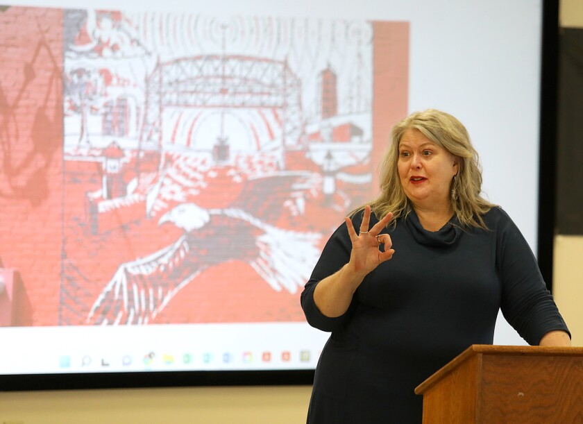 Shannon Laing, Main Street Lincoln Park Program Director, talks about some of the information folks will see if they scan the QR codes on plaques on murals