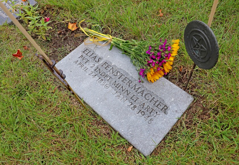People gather at Evergreen Cemetery.