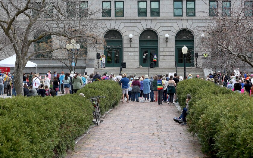 People gather at Duluth City Hall for a protest